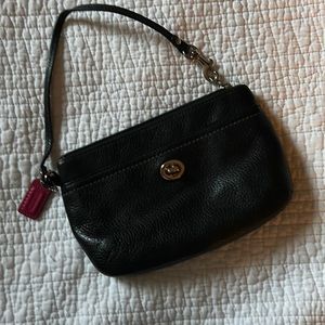 Black wrist purse with teal lining